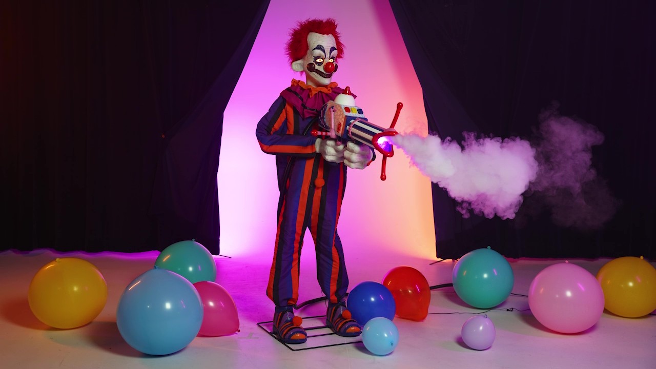 Turn your yard into Crescent Cove with the 5.6FT Rudy animatronic from Killer Klowns from Outer Space! With freaky face paint, glowing features, and eerie motion, this outer space menace is ready to steal the show—and your soul.